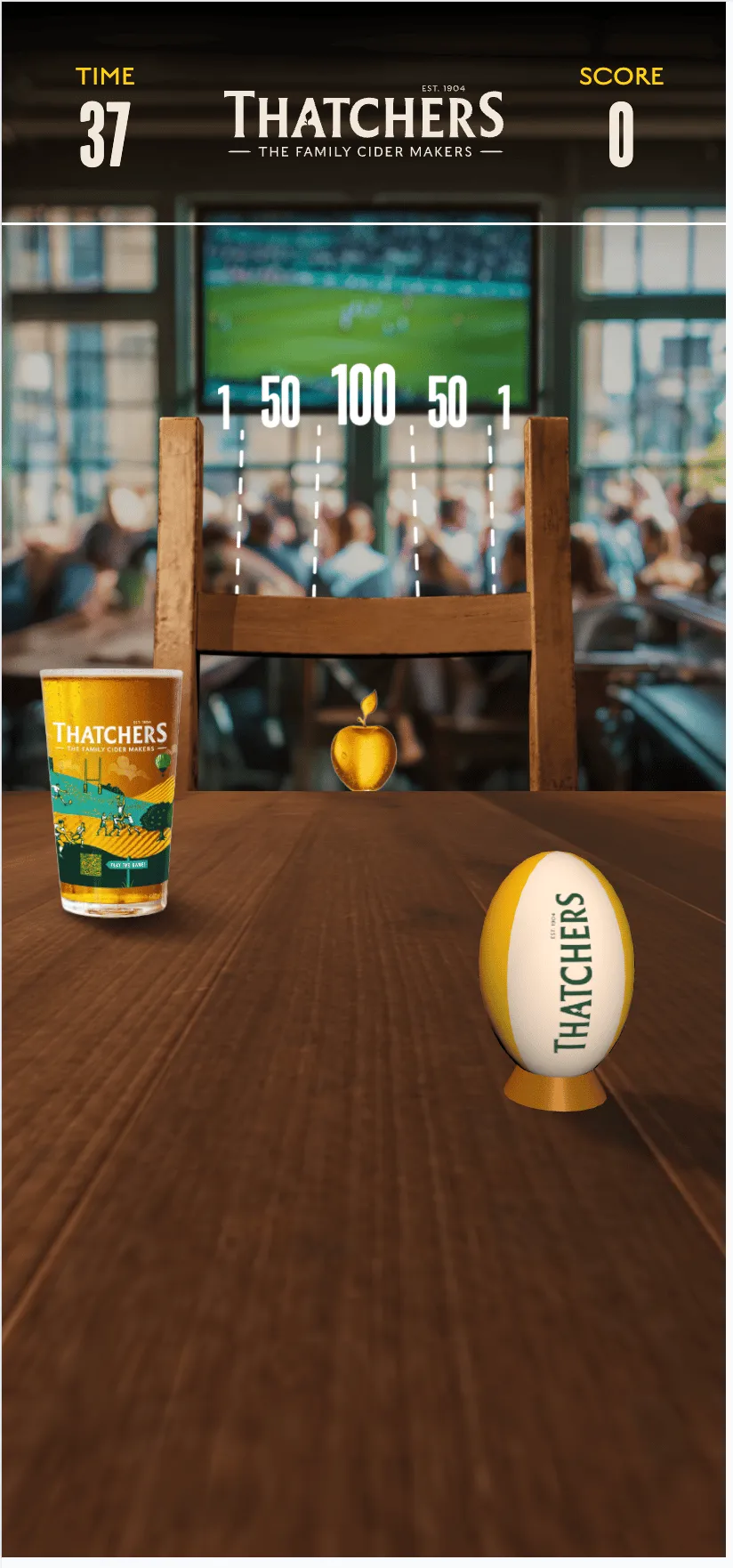 Final gameplay screen: a rugby ball on a pub table aimed at a chair back marked with score zones, a golden apple target, and the time and score at the top.